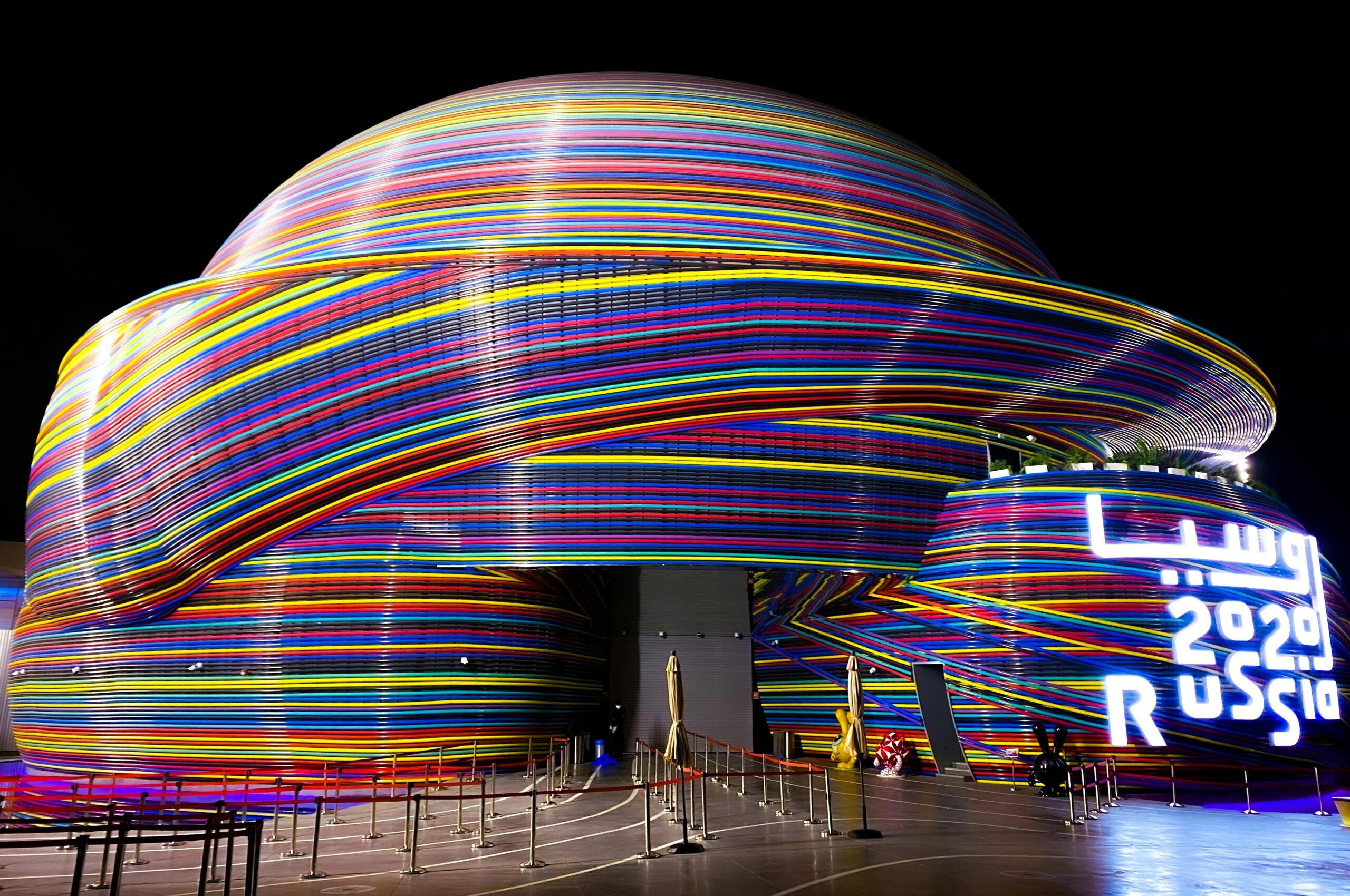 pexels-photo-10981974-10981974 Vibrant neon-lit Russian Pavilion at Dubai Expo 2020, showcasing modern architecture.