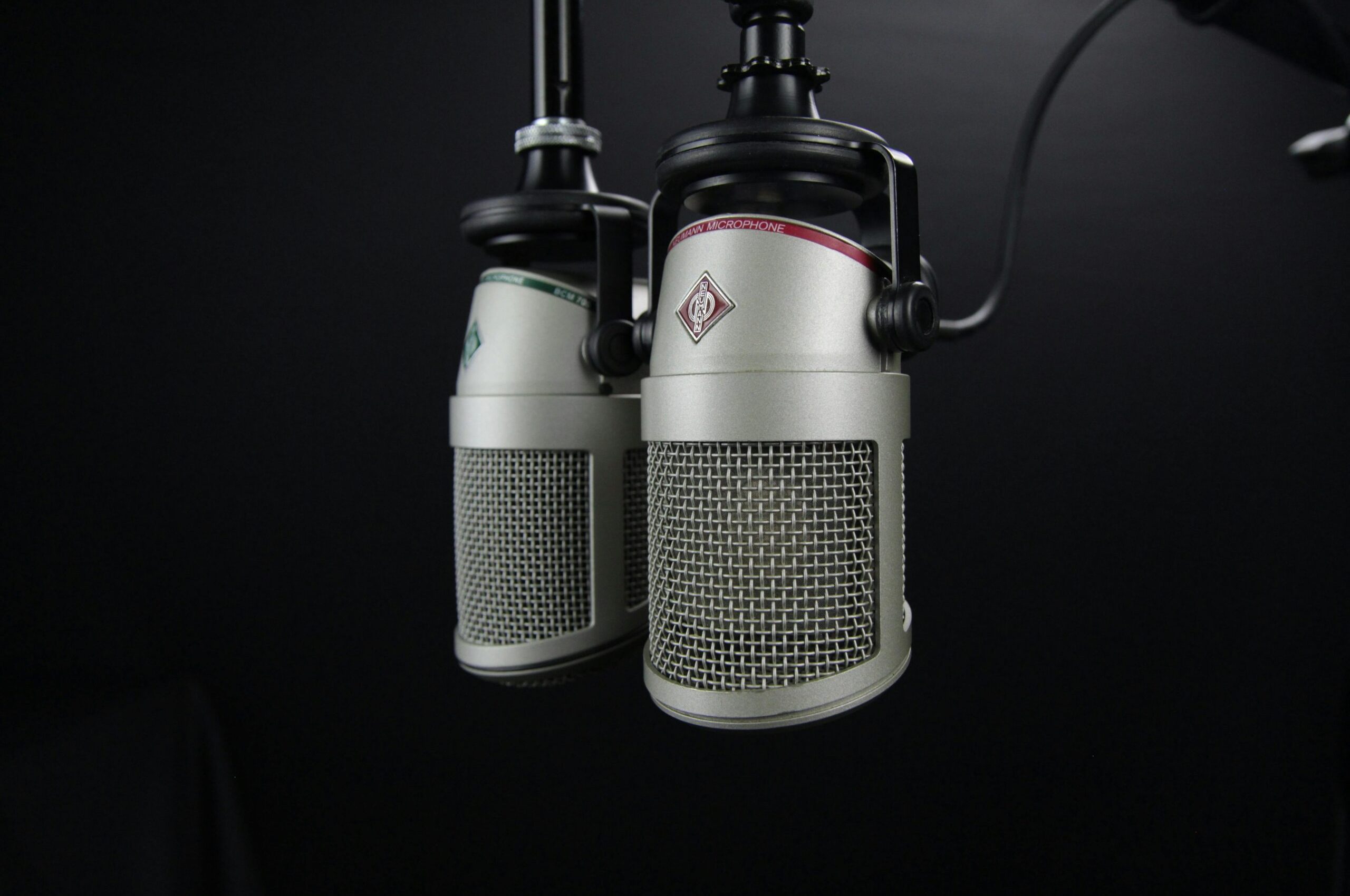 pexels-photo-270288-270288 Close-up of two professional microphones in a recording studio, ideal for podcasts and music production.